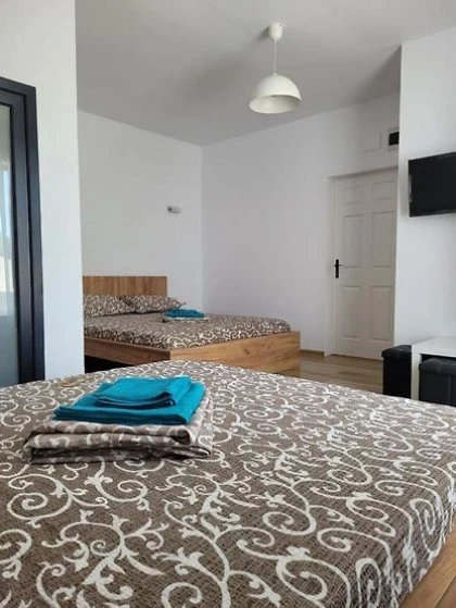 Dormitor_cu_doua_paturi.webp